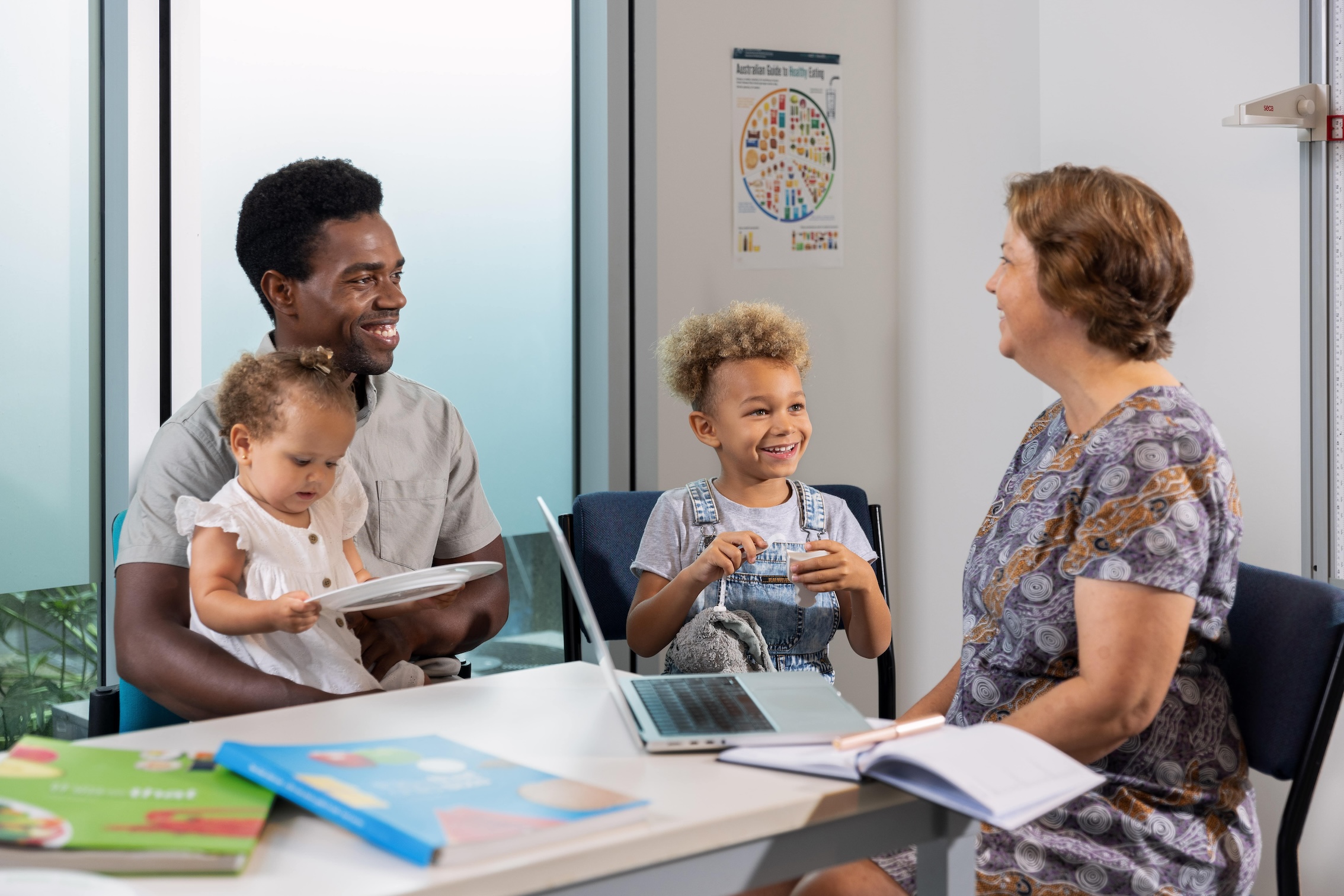 Health professional with parent and kid